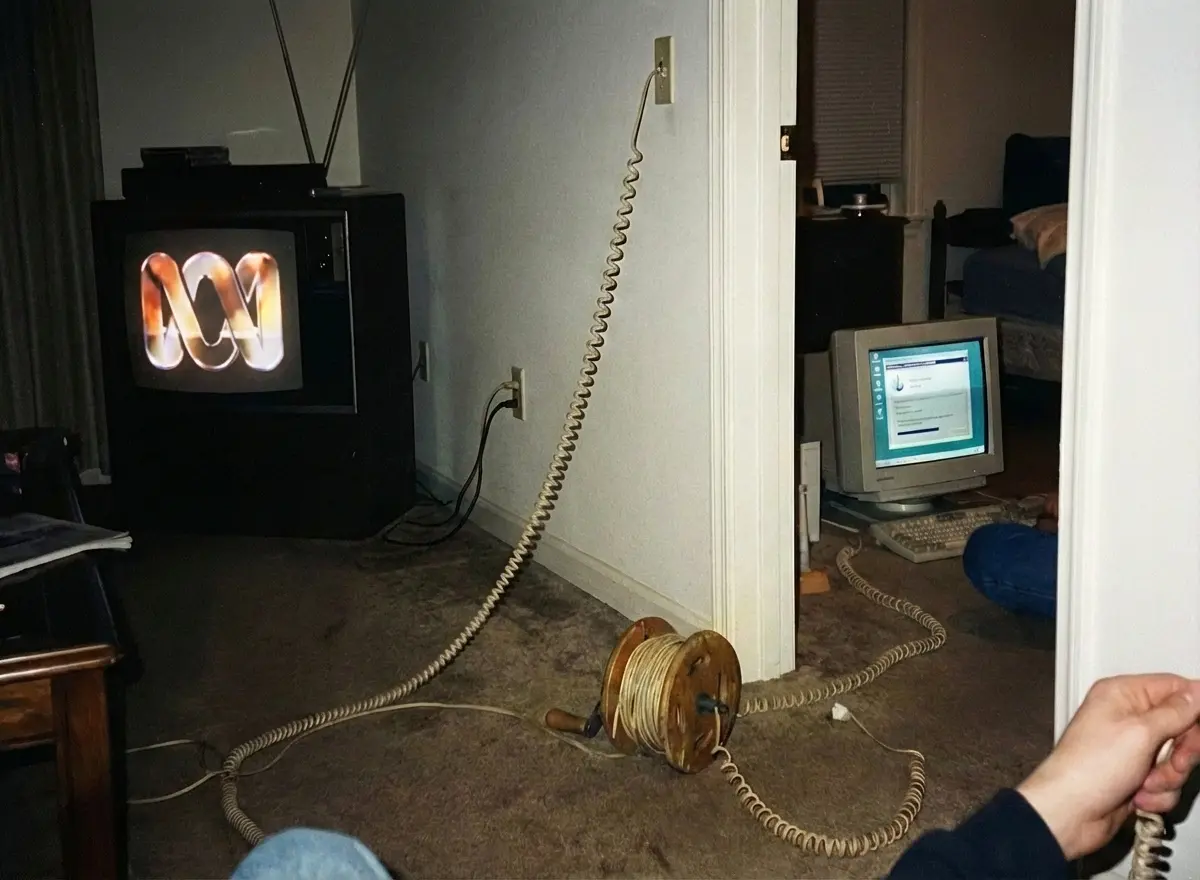 The original setup: ABC on the TV, fishing reel modem cable, computer in the next room